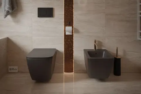 Nowoczesna łazienka z podwieszanym WC i bidetem. Złota armatura dodaje elegancji. Dowiedz się, jak korzystać z bidetu.